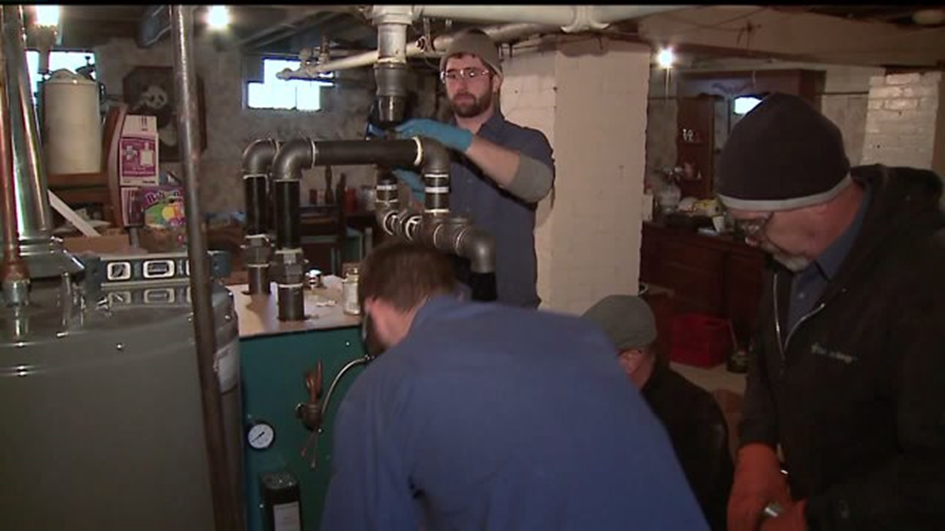 Woman receives free heating system