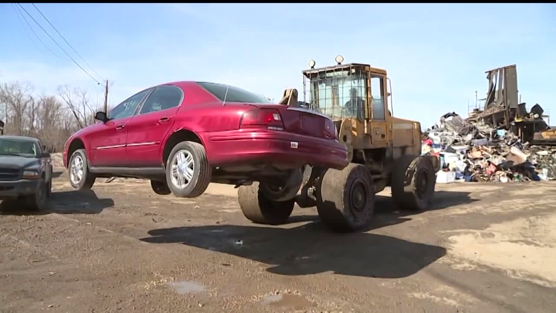 Man says salvage yard to blame for metal through his roof