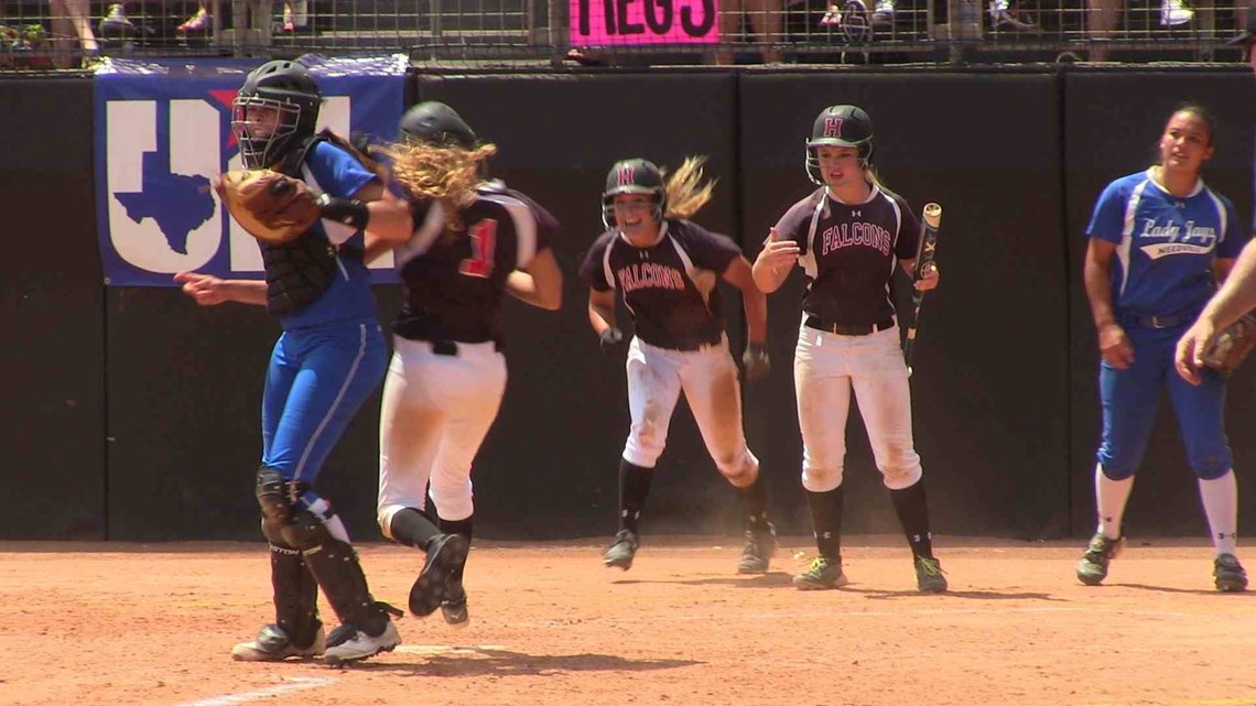 High school softball catcher elbows players to miss home plate