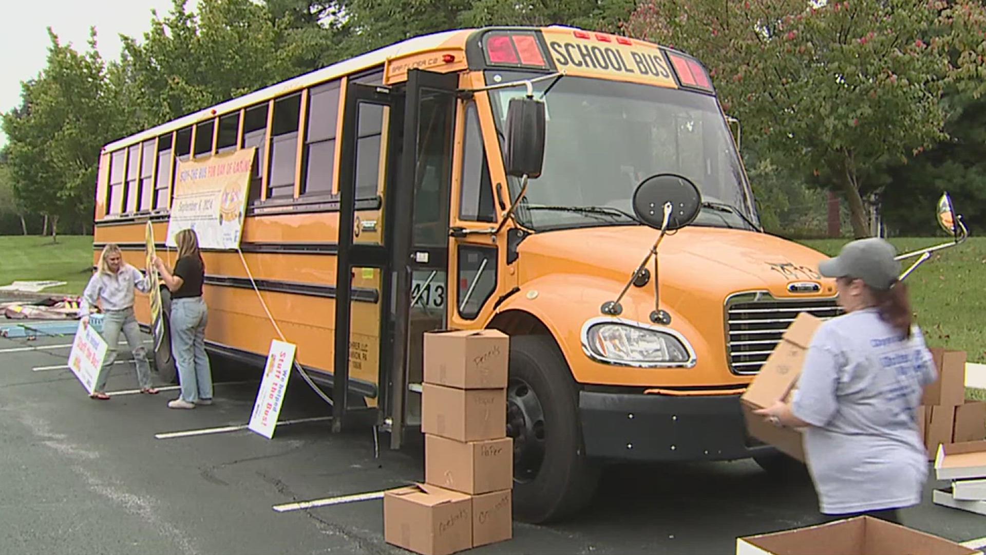 United Way of the Captial Region donors, volunteers, corporate supporters and local community members stuffed three buses of supplies for local school districts.