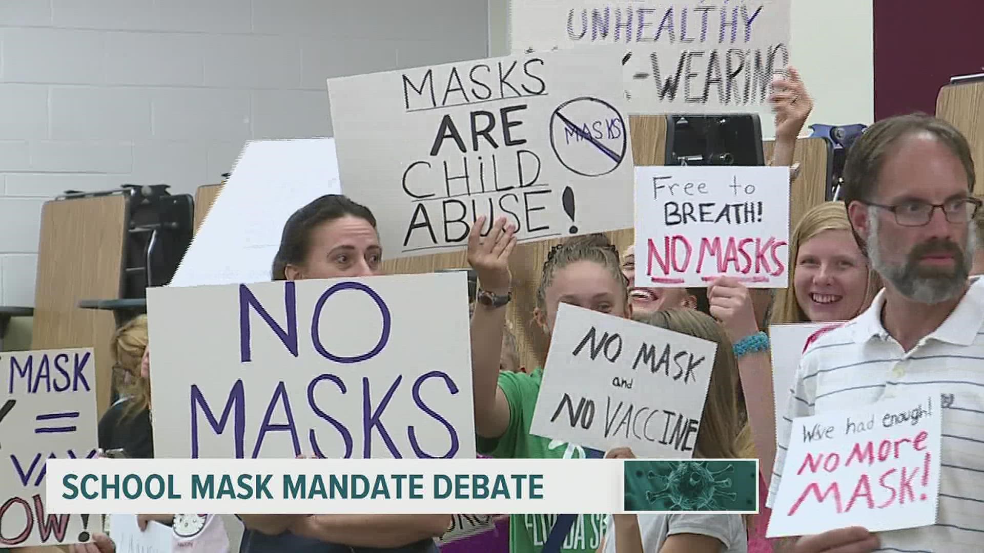 Parents and school district administrators wage fierce debate over whether to require that students wear masks.