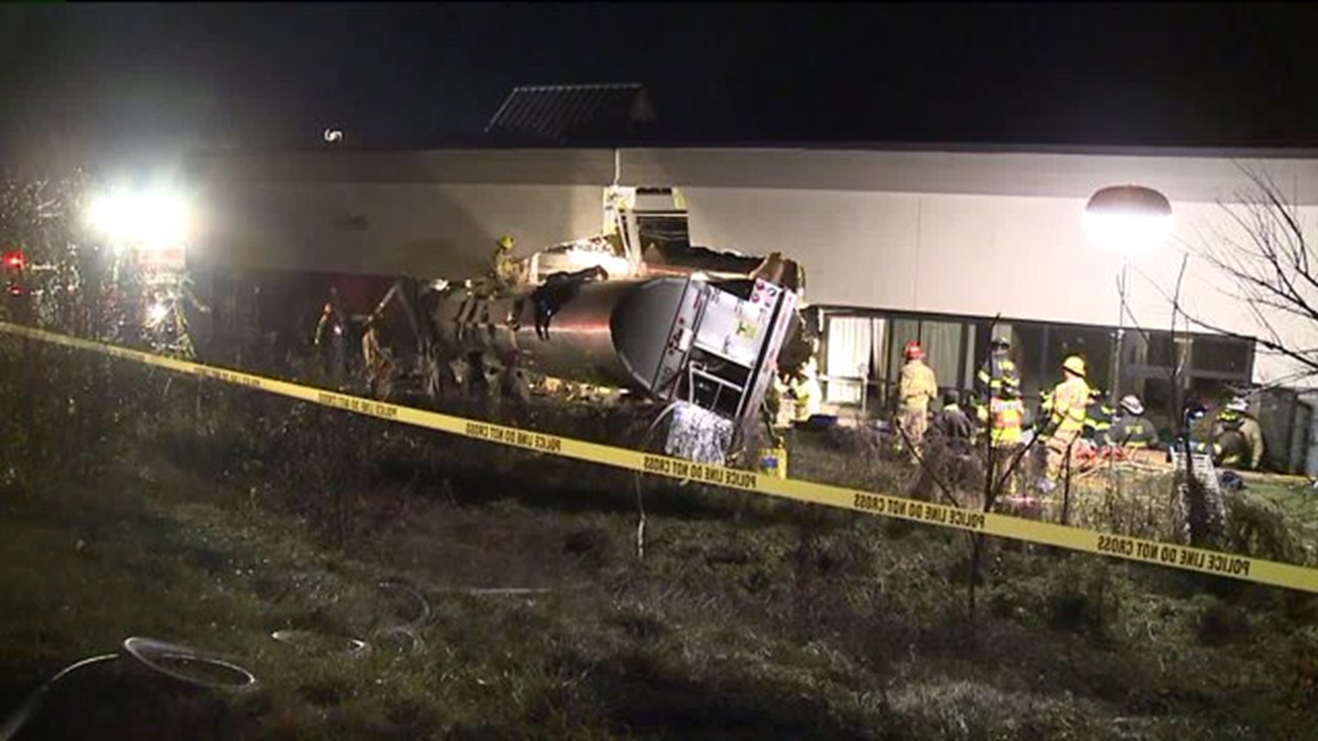 At least 1 person dead after tractor-trailer crashes into medical building