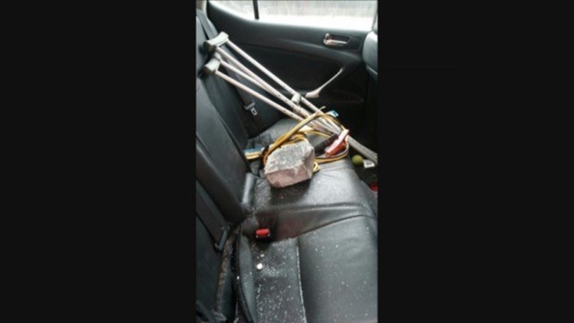 Woman nearly killed after boulder smashes through her windshield ...