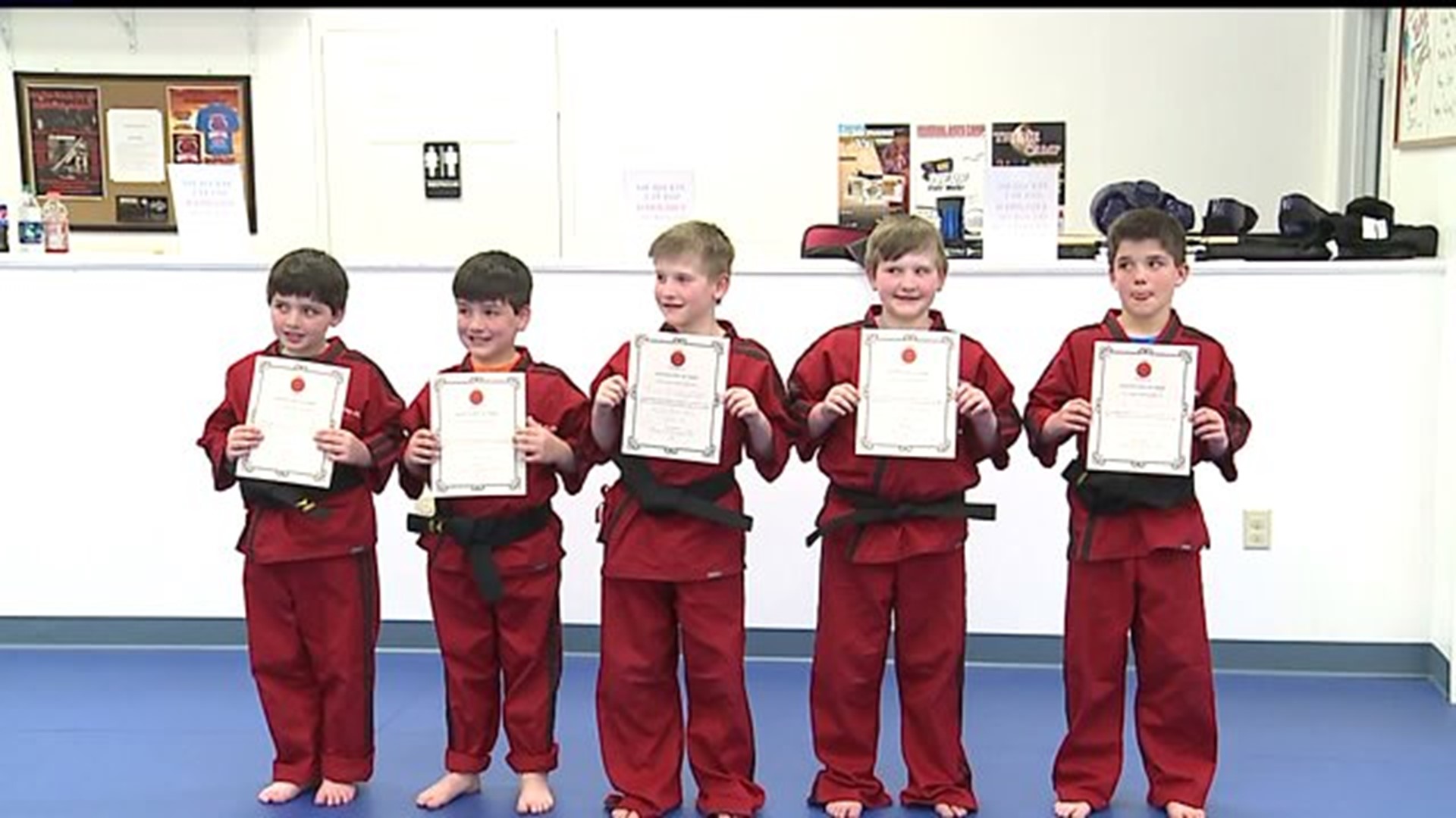 Quadruplets earn black belts