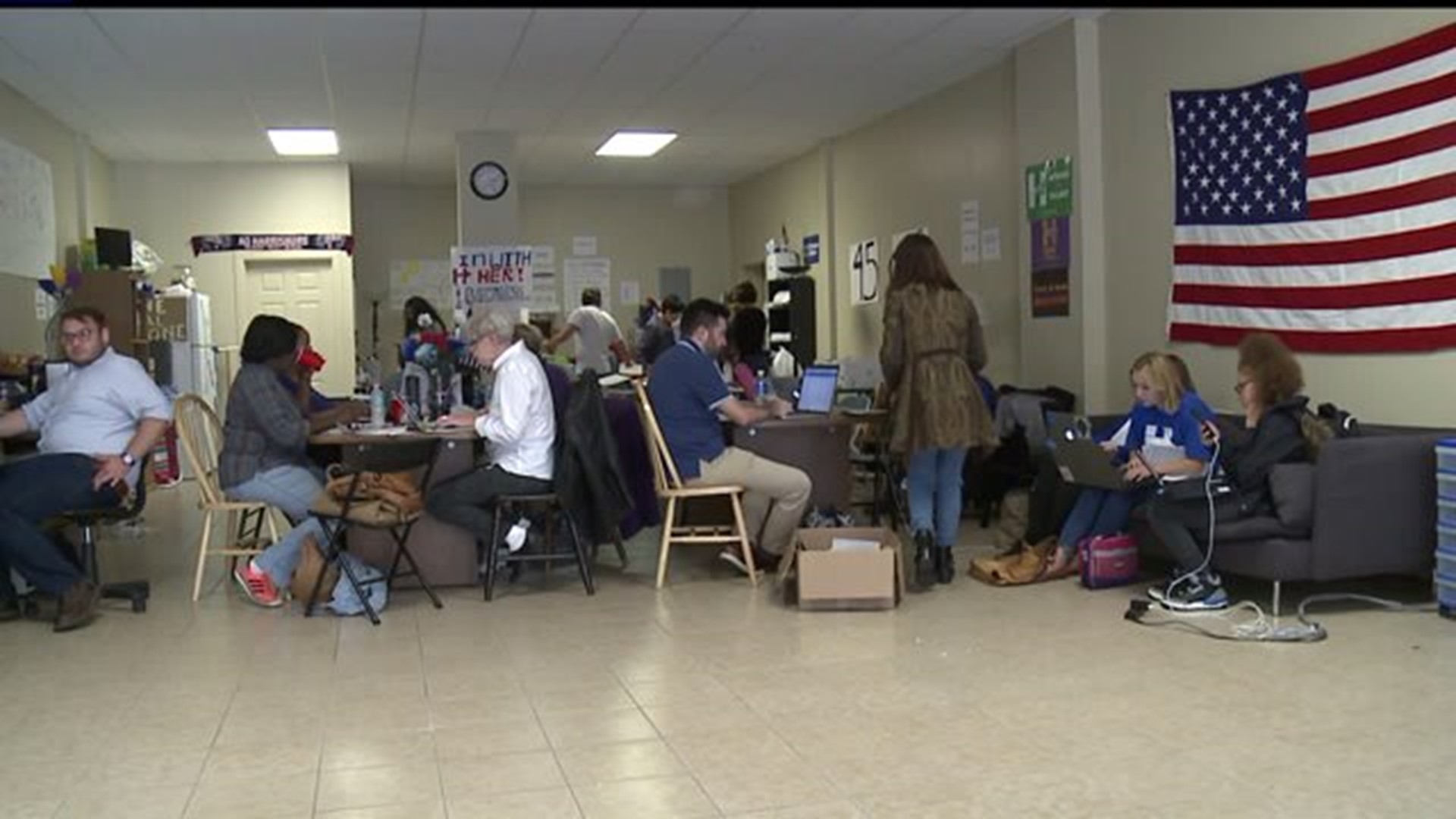 Volunteers encourage people to register to vote