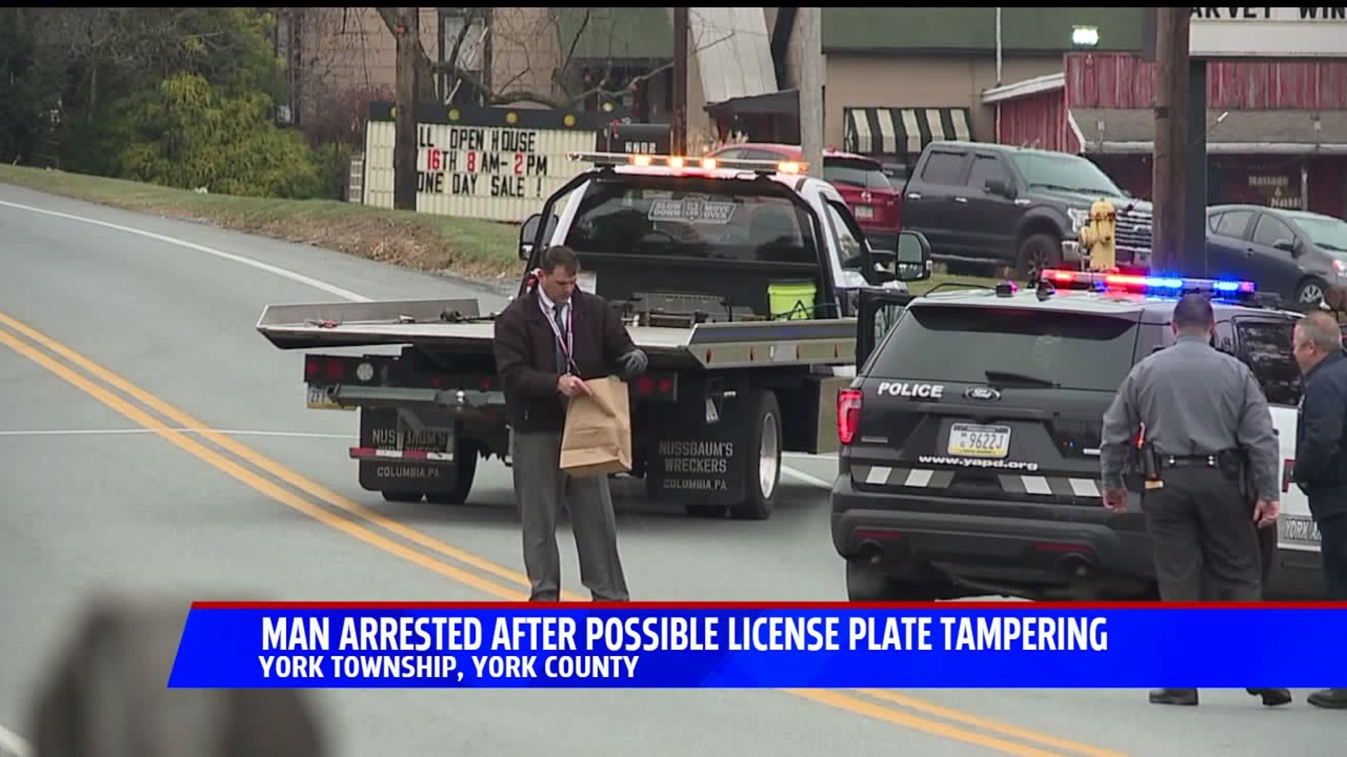 Man arrested after possible license plate tampering