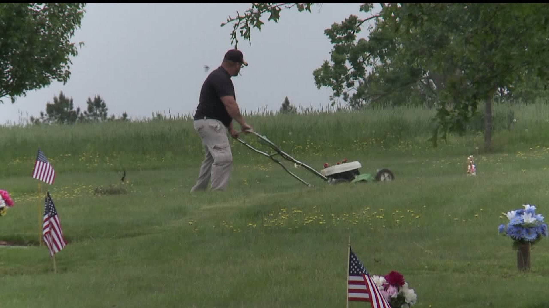 Volunteers mow unkempt cemetery in York County