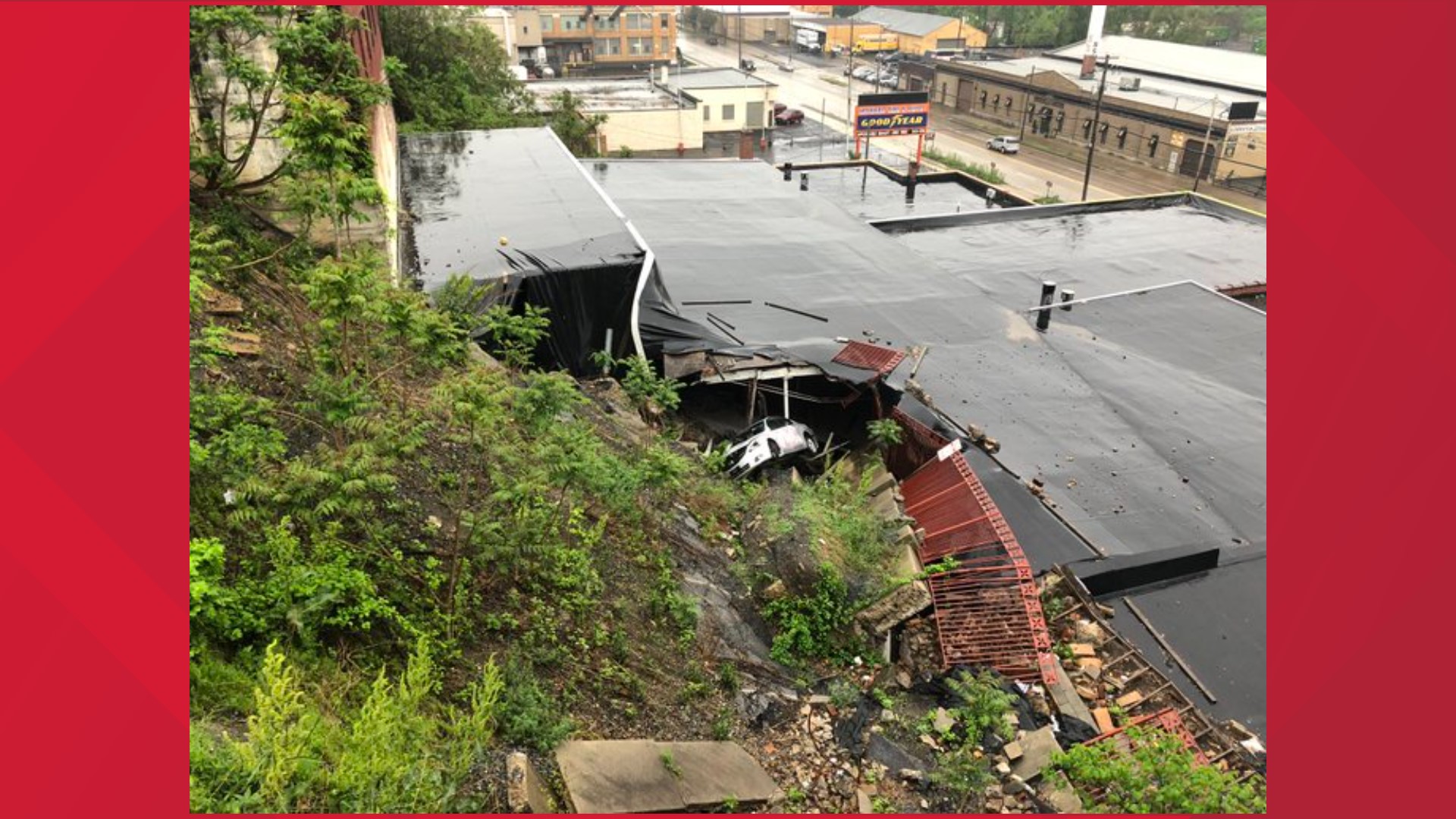 A retaining wall above Howard Tire and Auto collapsed under the weight of heavy rains on May 5, 2016.