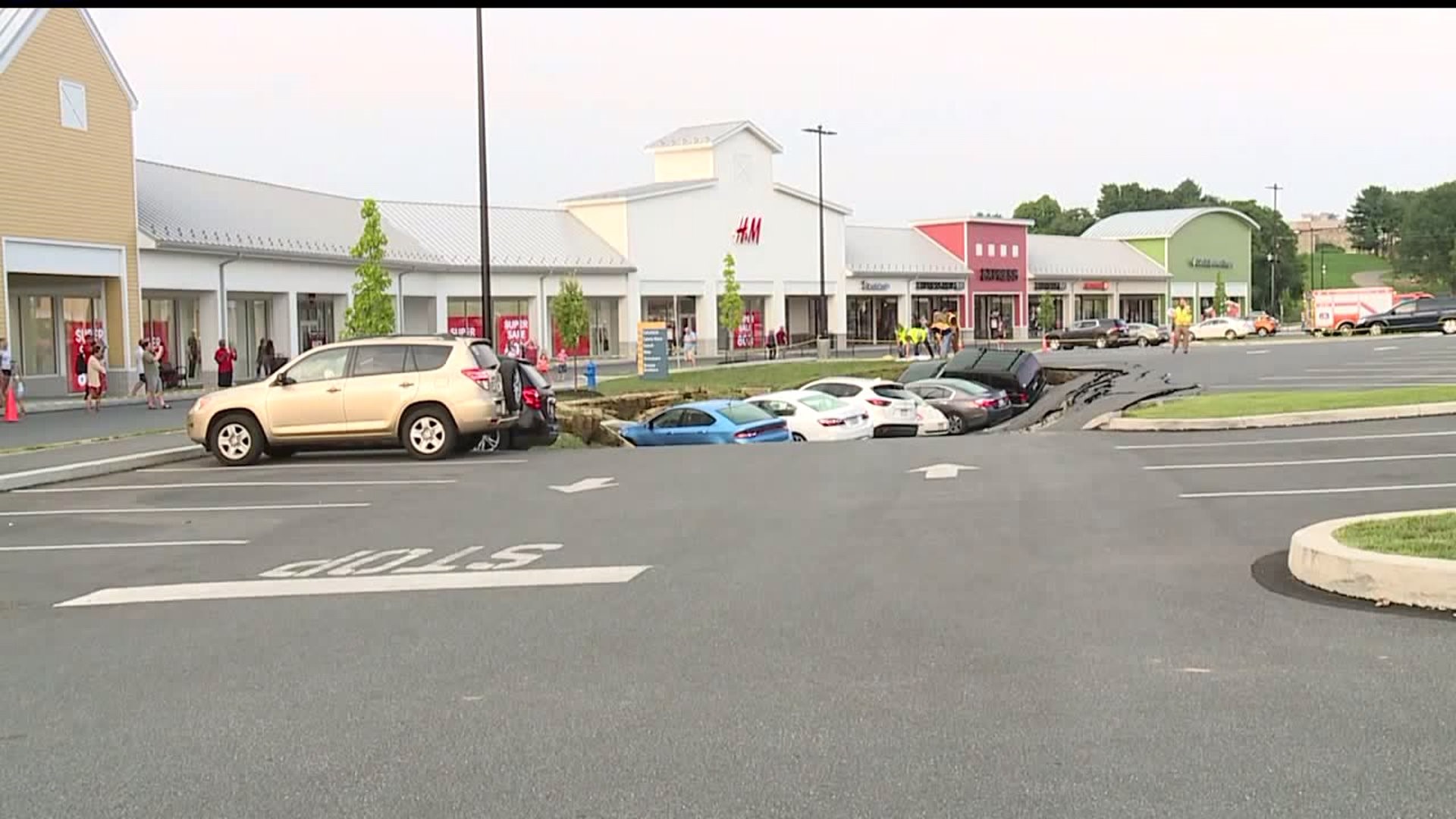 Multiple cars damaged at Tanger Outlets after a sinkhole opened