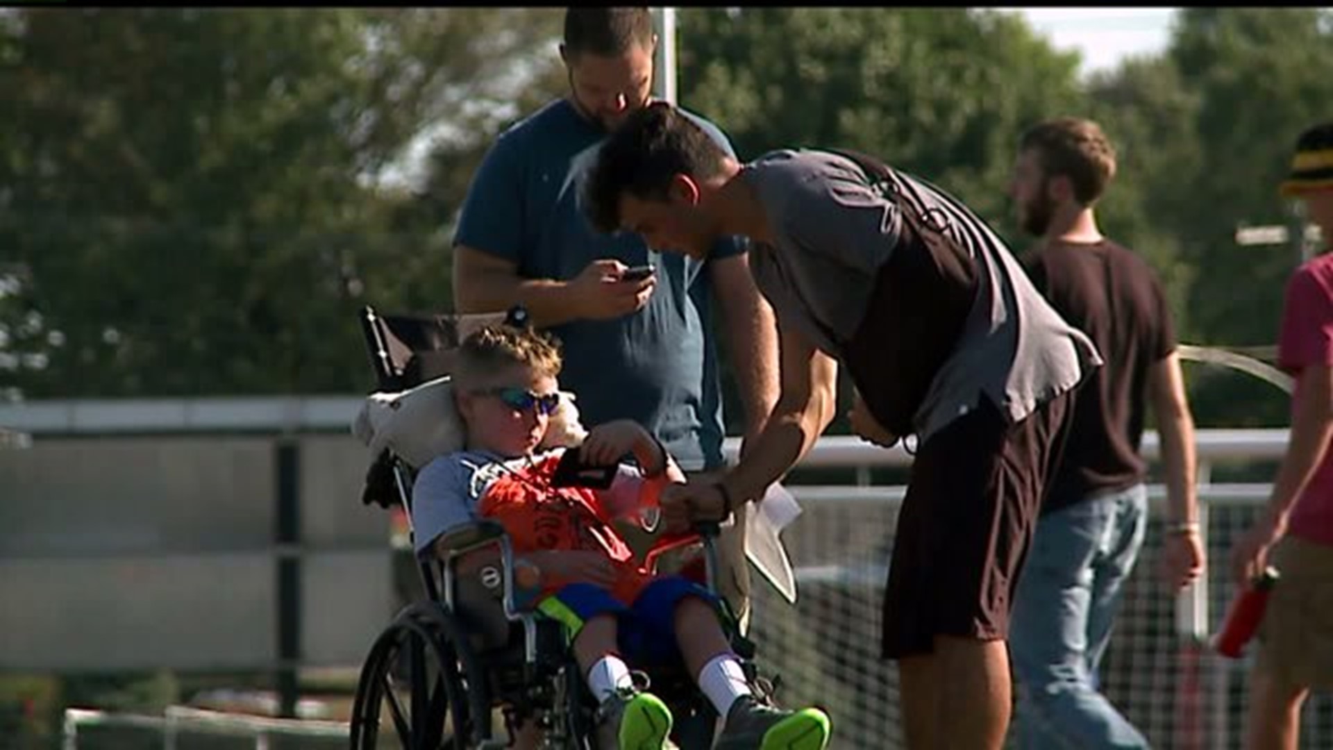 Local 9-year old boy with brain tumors coaches varsity team