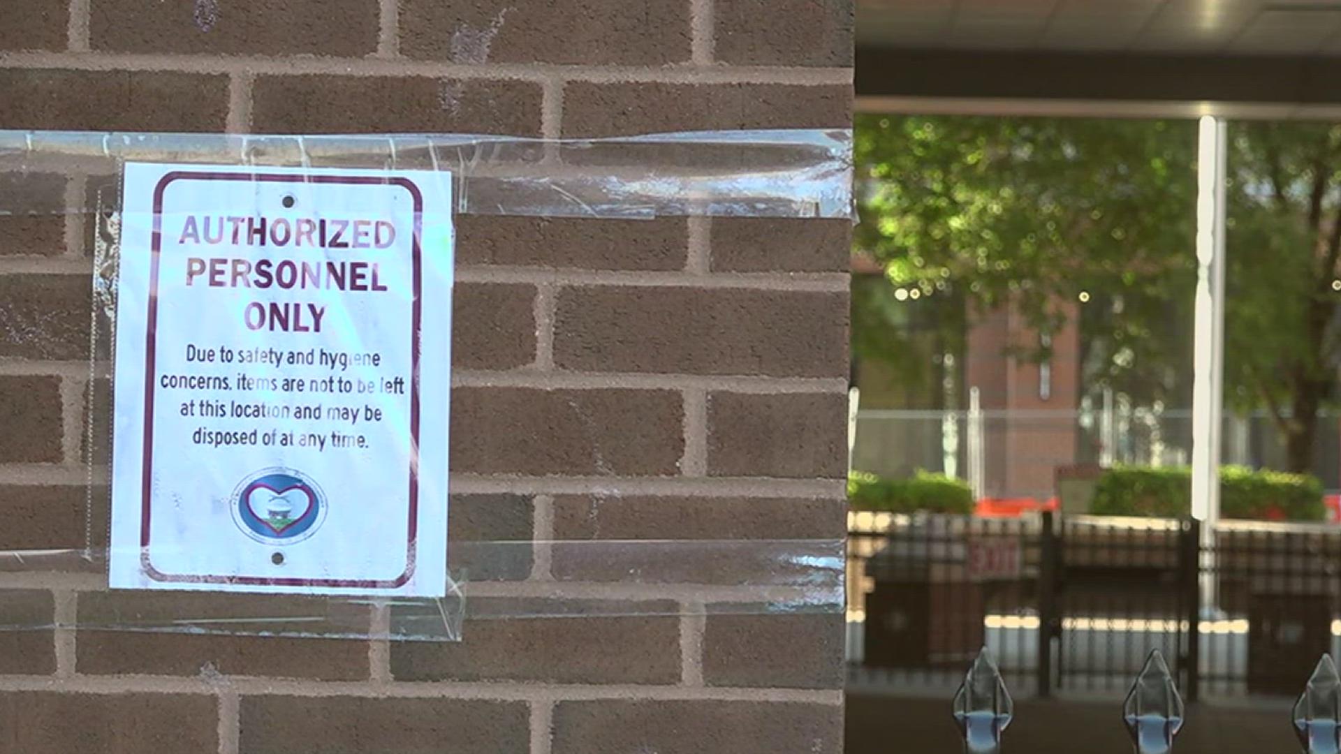 Homeless individuals can no longer gather or store their belongings in front of the county government buildings, officials say.