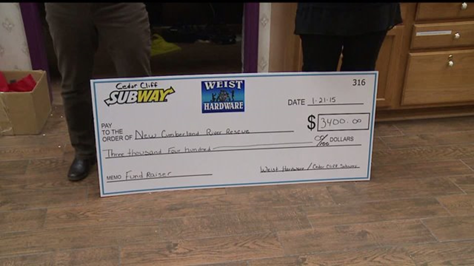 Local businesses present check to New Cumberland River Rescue