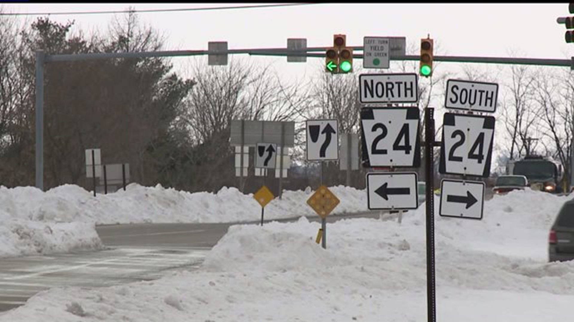 High snow piles create traffic nightmares at intersections