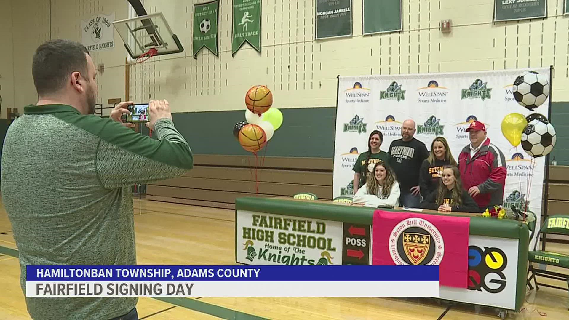 Two student-athletes sign their National Letter of Intent.