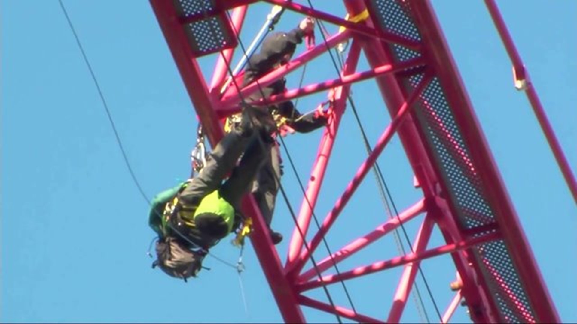 Protesters climb crane in Washington, D.C.