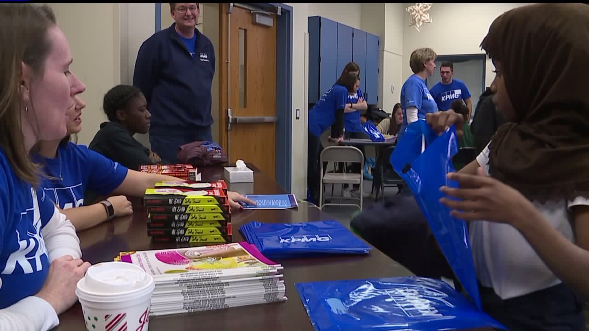 Students receive books at Literacy Extravanganza