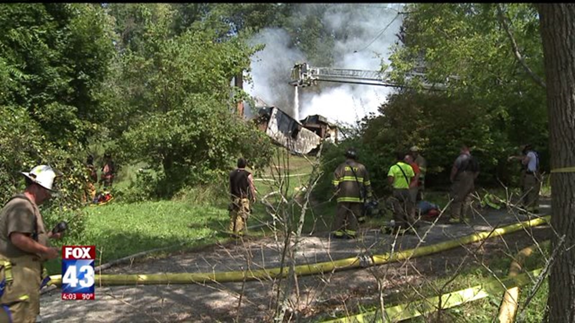 Crews battle house fire in heat and humidity