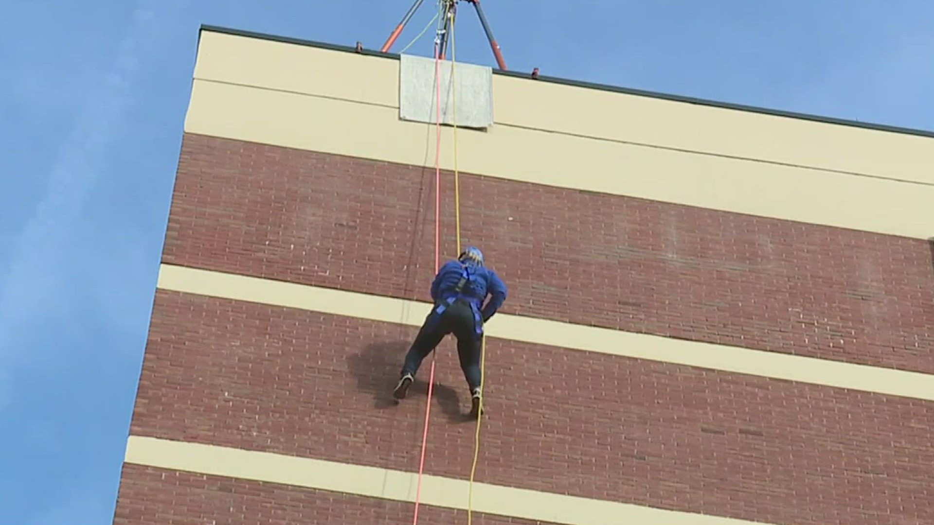 VisionCorps, a local nonprofit that provides services to the blind and visually impaired, is raising money today by rappelling down a 10-story building.