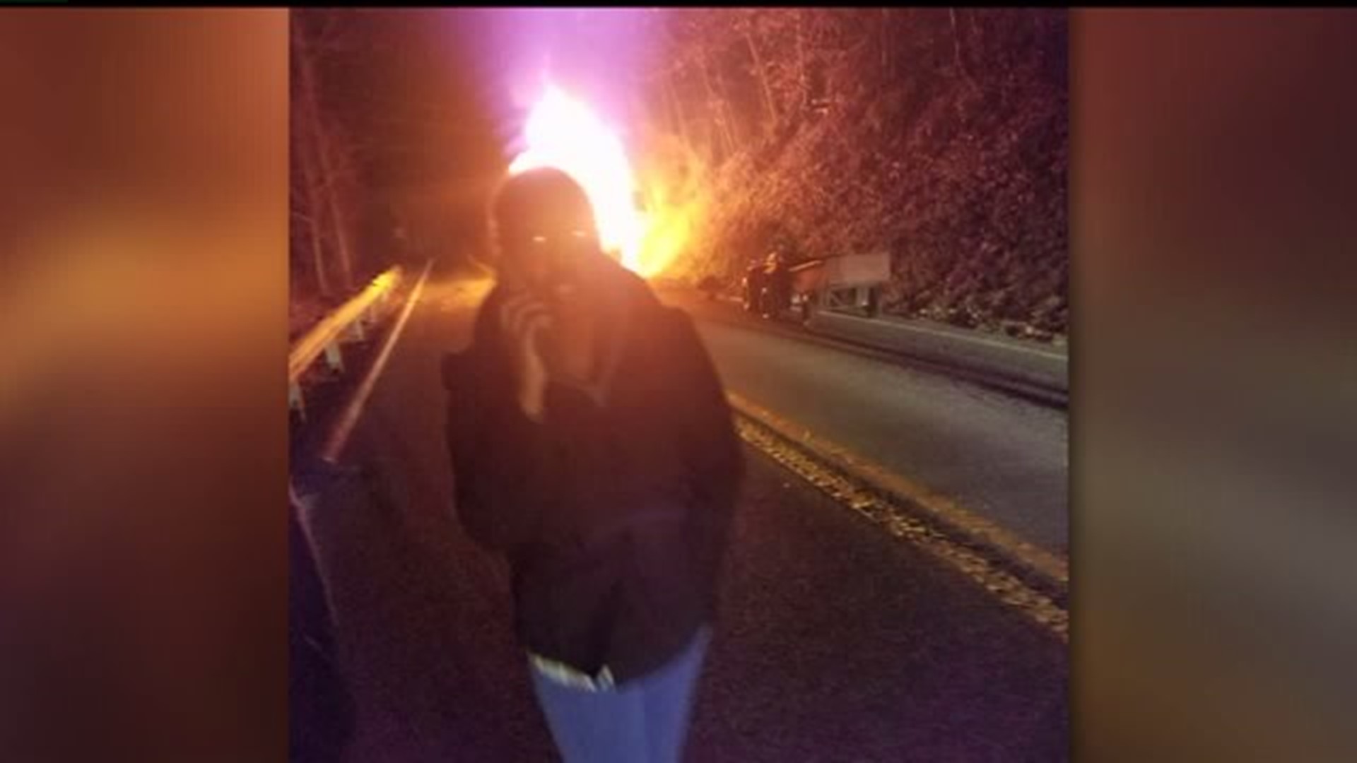Family comes to the aid of men trapped in burning car