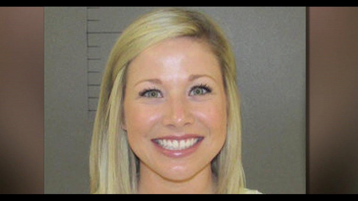 Smiling mugshot of teacher accused of inappropriate relationship with