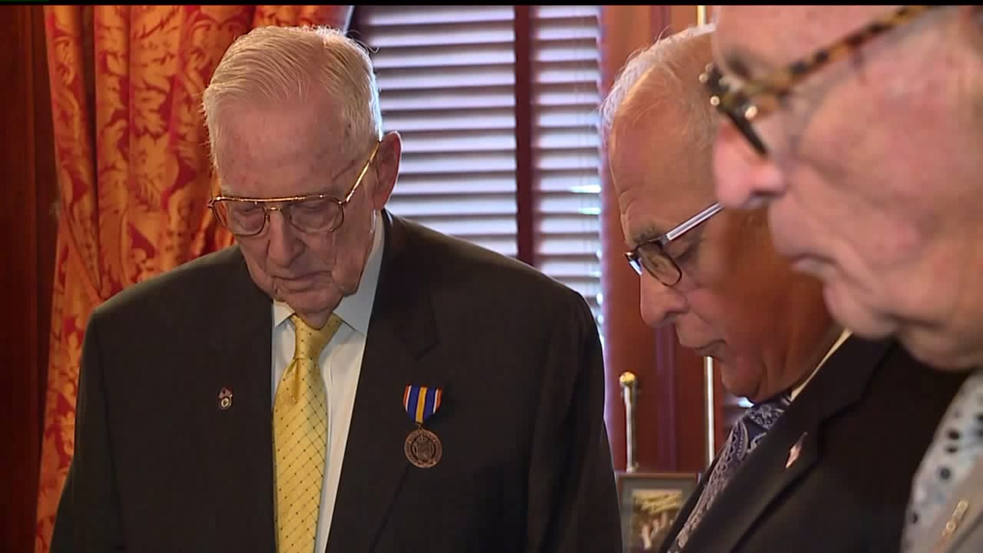 Two civilians leaders receive military honor