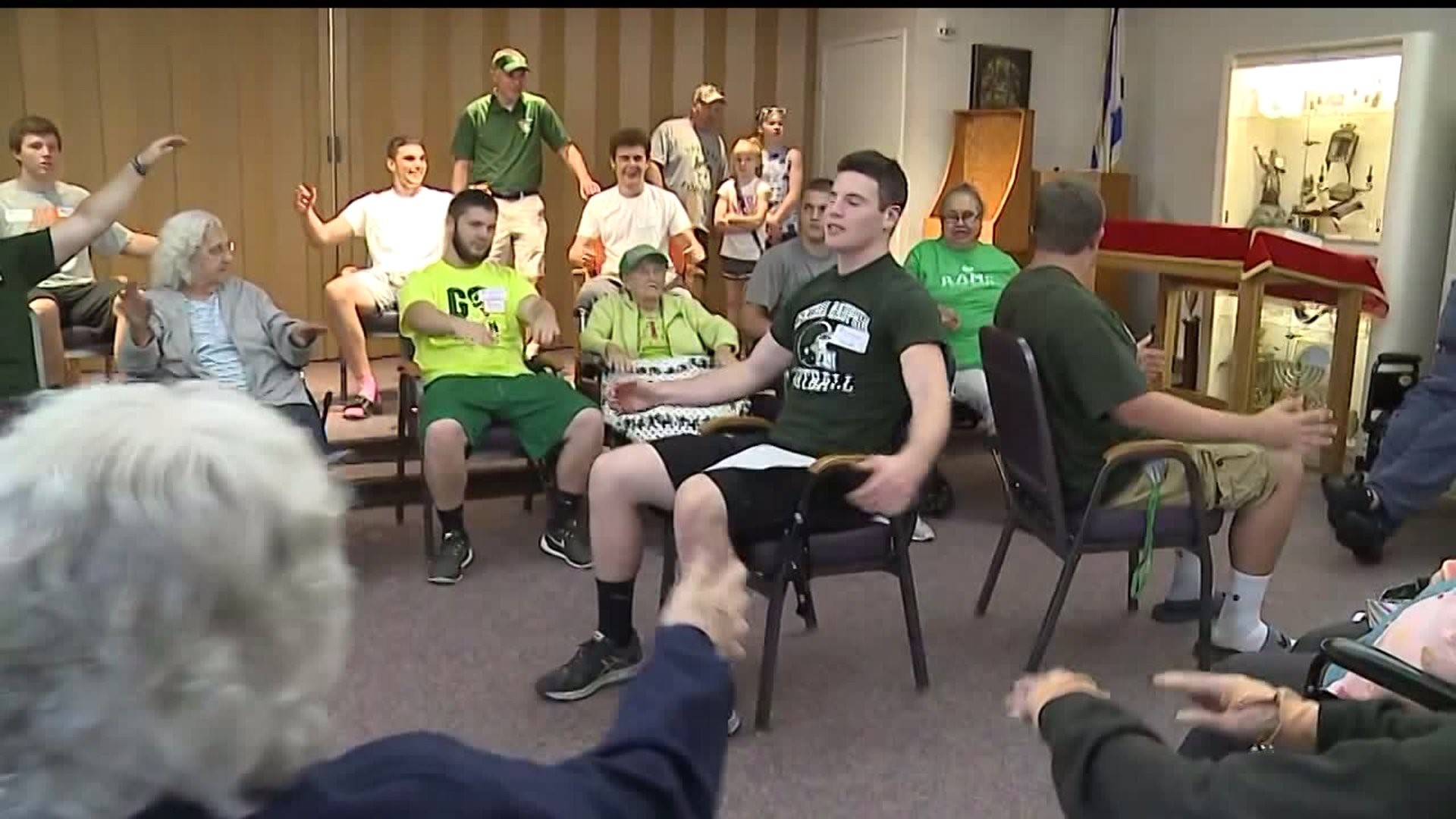 Central Dauphin football players give back 10,000 hours of community service