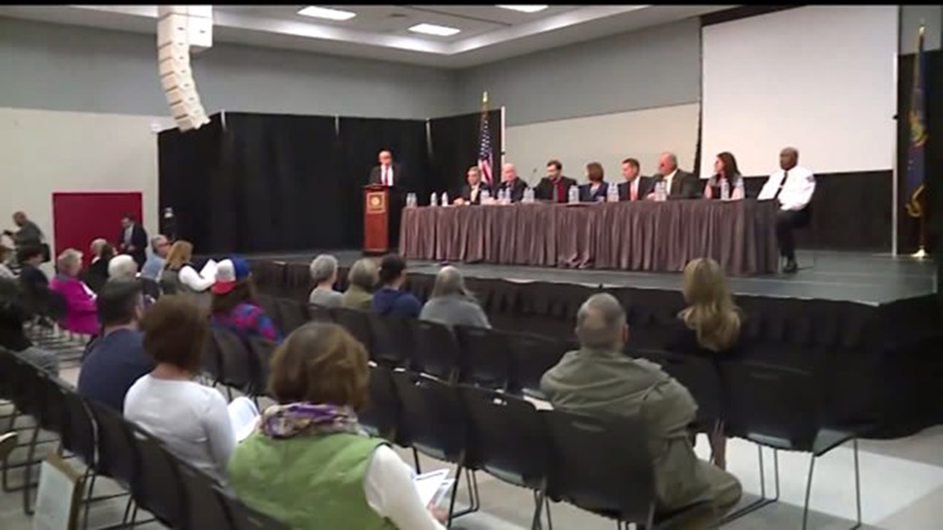 Opioid forum brings out silent protesters