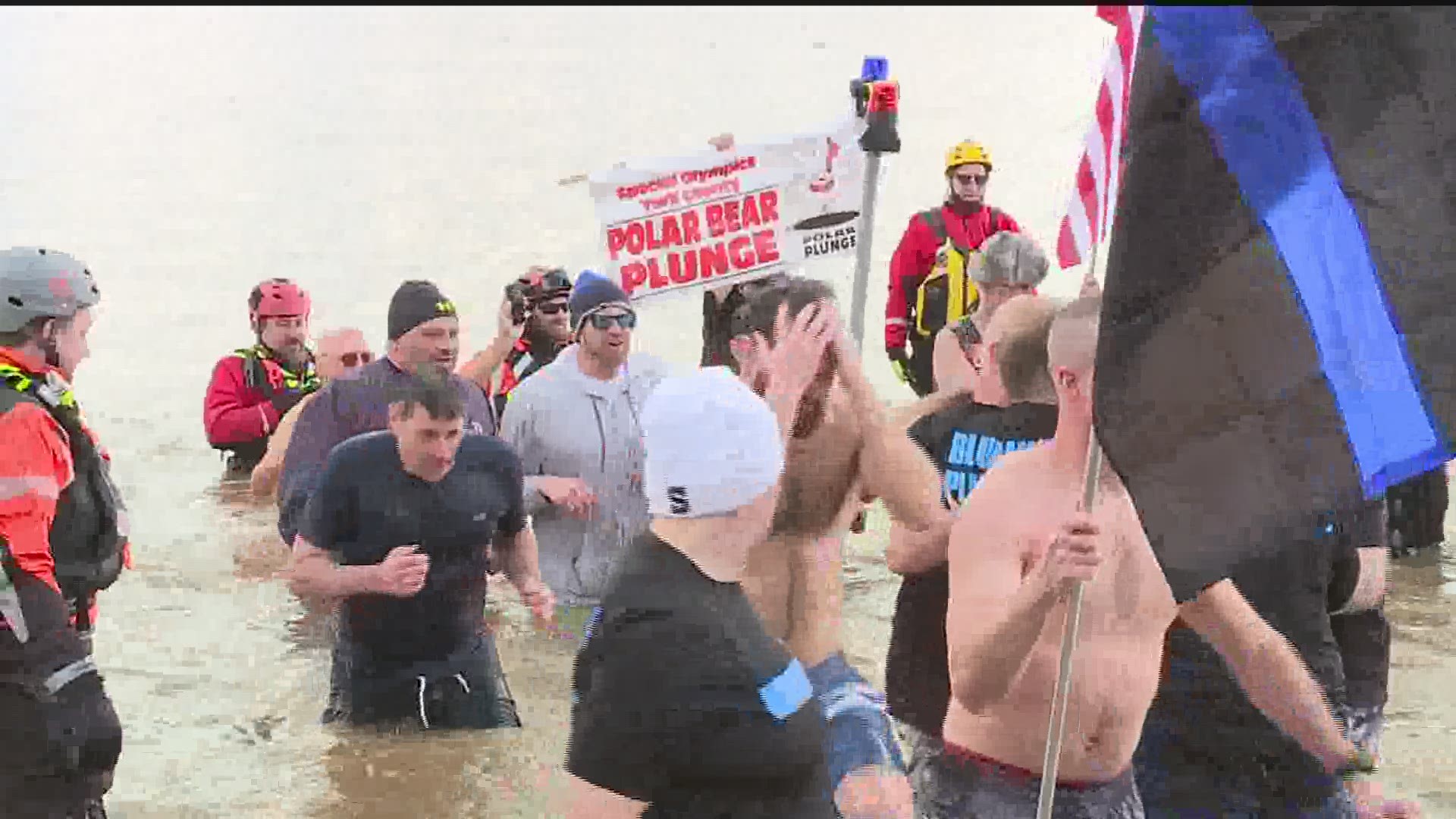 Dozens of brave souls dive into the Susquehanna River to benefit people with special needs