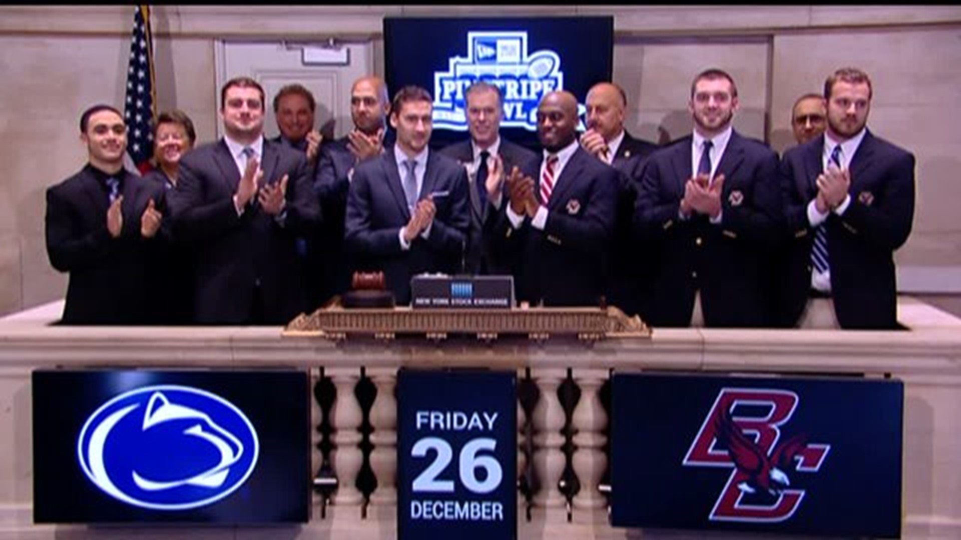 Penn State football players ring the opening bell at NYSE with chants of "We are, Penn State"