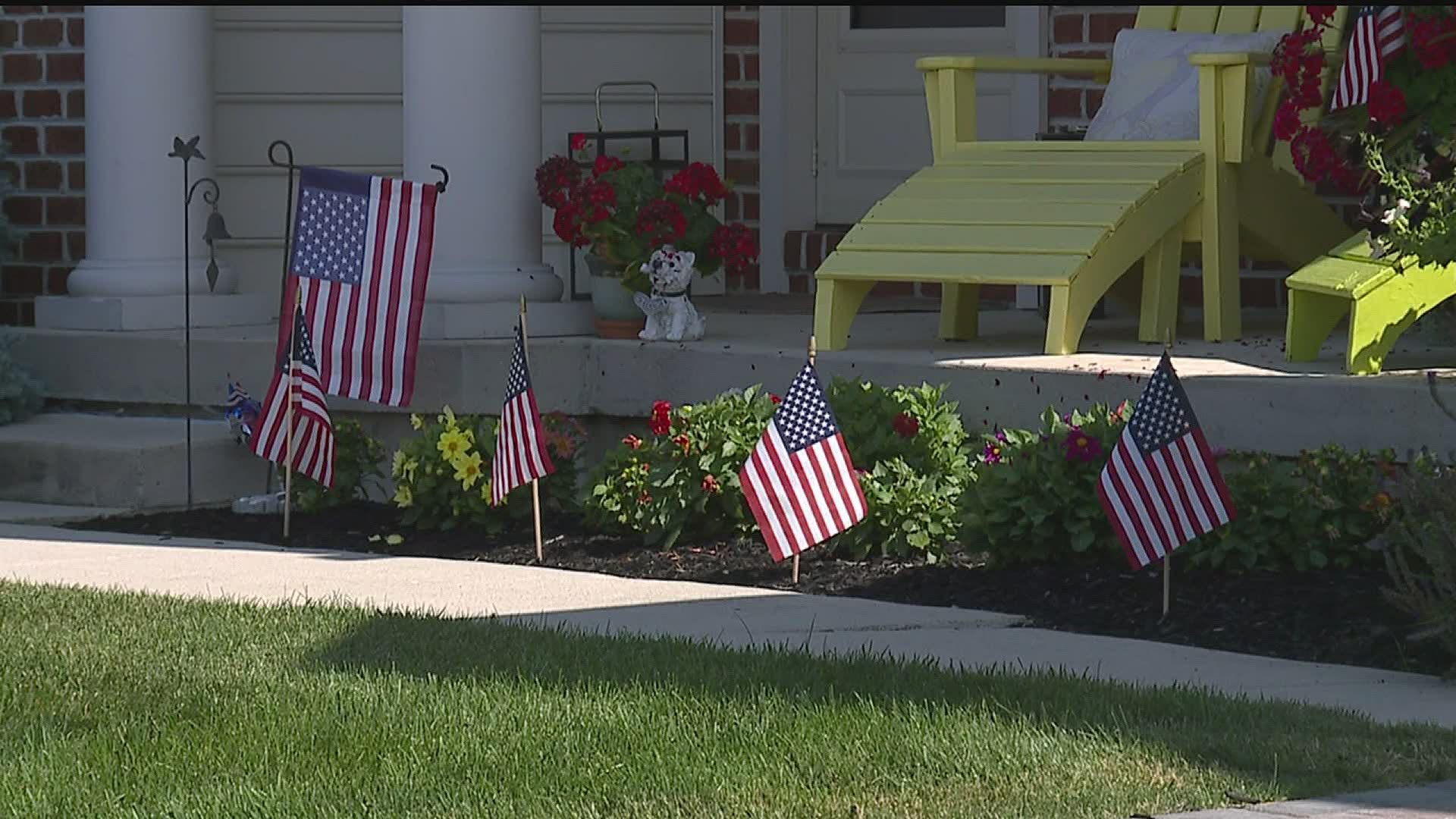 The neighborhood honored the nation by decorating with hundreds of flags.
