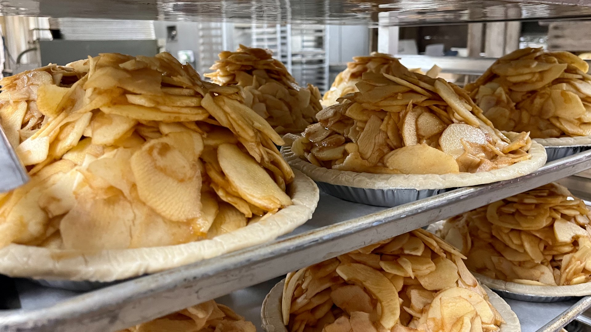 Owner Mary Brown demonstrates how to make a caramel apple nut pie available at Brown’s Orchards & Farm Market.