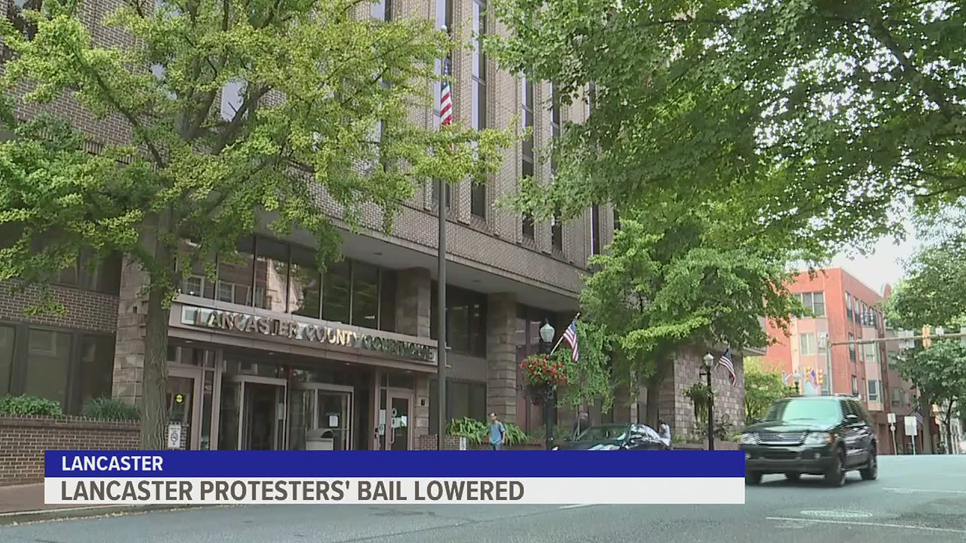 Nine of the 13 protesters arrested for their roles in this week’s protests had their bails lowered Thursday, following public outcry against their original bail.