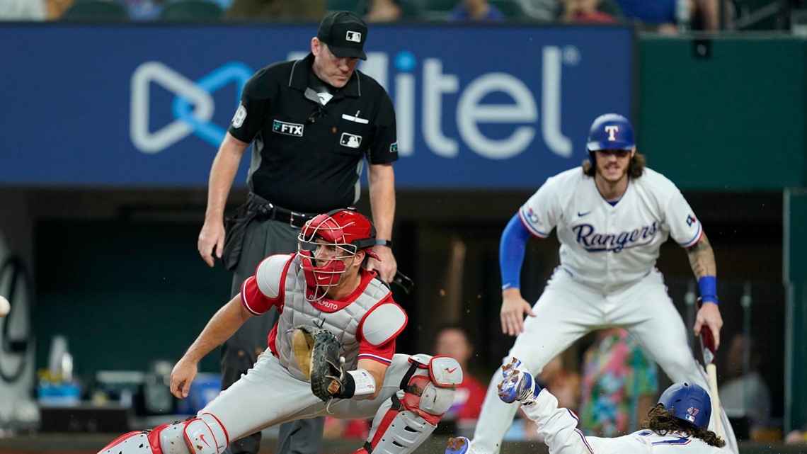 Kole Calhoun of the Texas Rangers runs the bases after hitting a