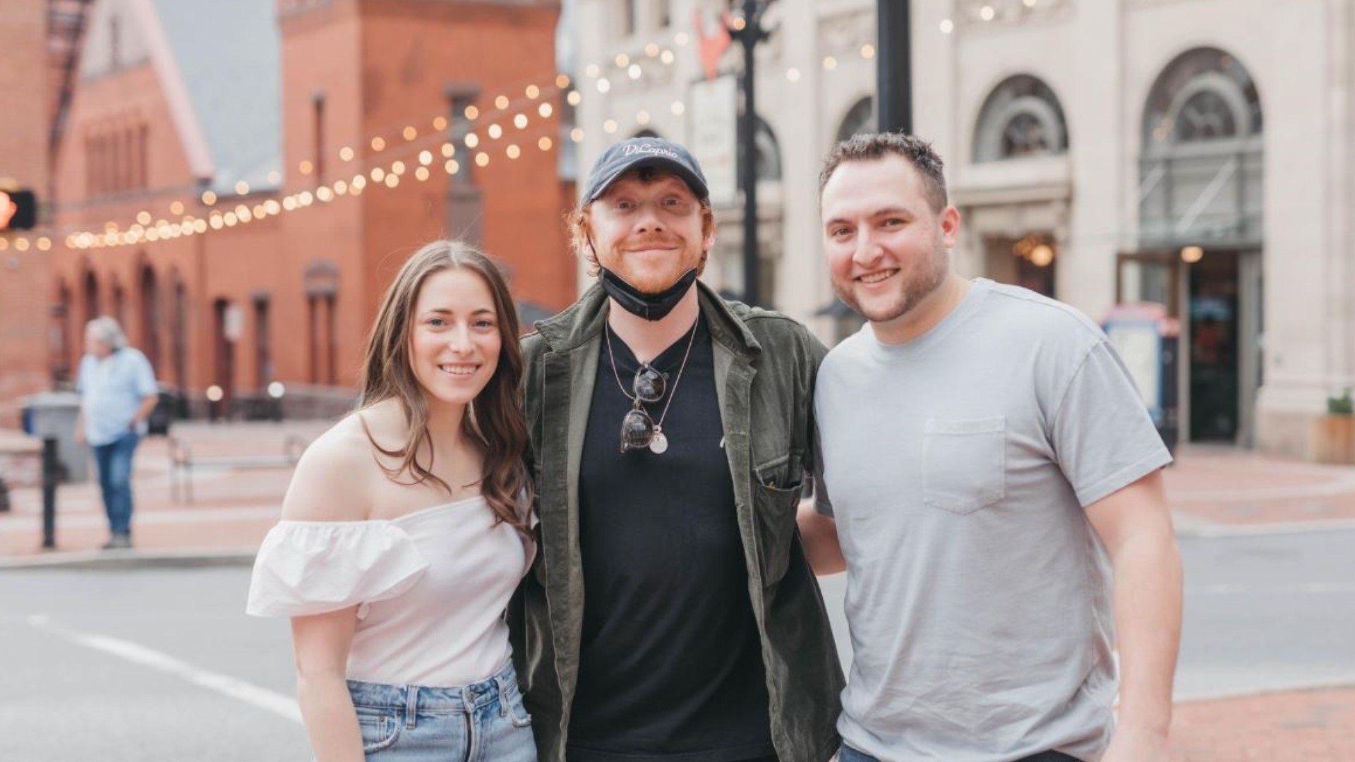 The actor, who played Ronald Weasley in the Potter films, posed with a couple who was in Penn Square taking engagement photos Wednesday evening.