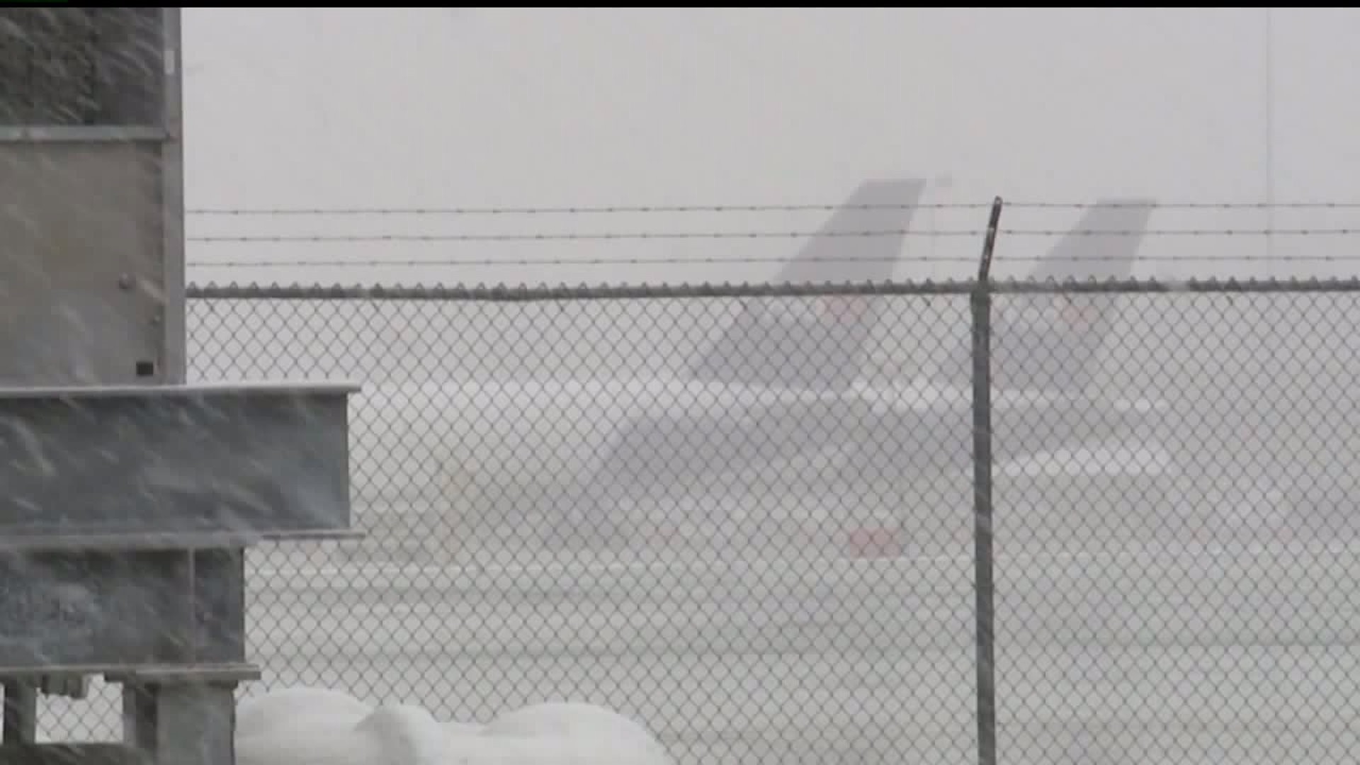 Airline passengers try to escape snowy conditions, others return home to it