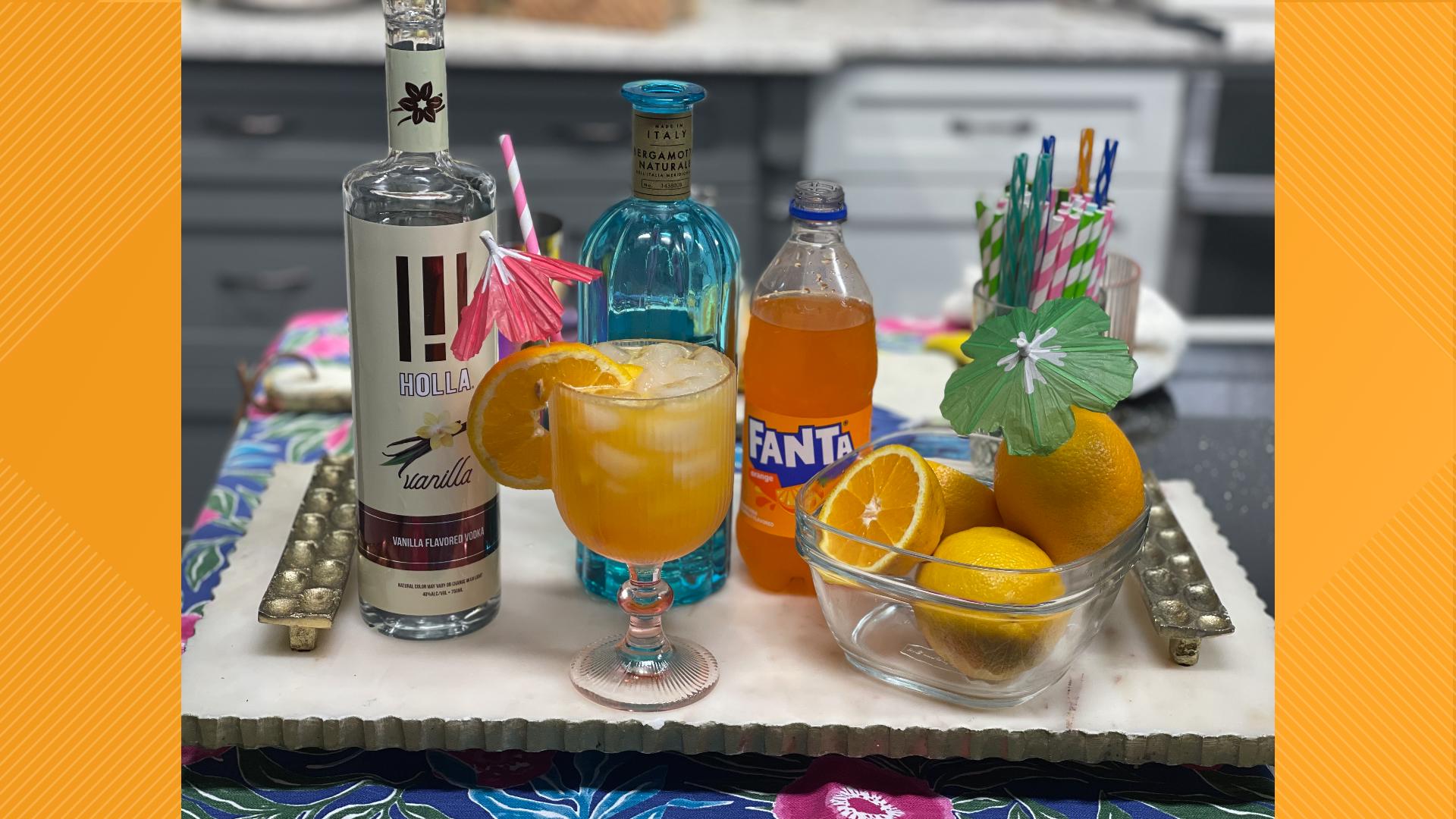 A refreshing Creamsicle Crush cocktail soothes your taste buds and counteracts the spice of Olivia's Jamaican Style Pineapple Shrimp Po’boy.