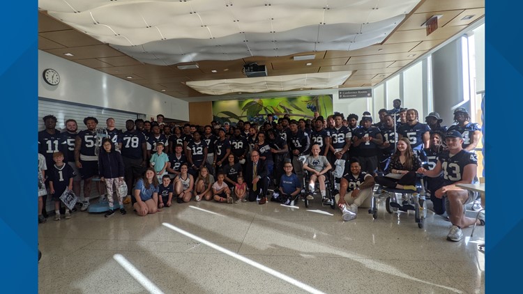 Penn State football players visit children at Penn State Health Children's Hospital