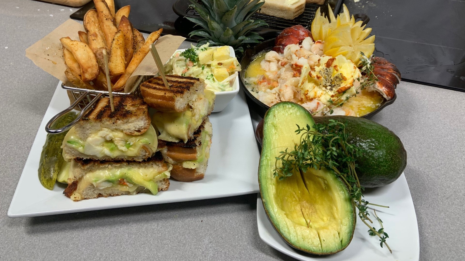 Butter poached lobster and seasonal avocado stuffing with piña colada coleslaw on the side takes the sandwich from classic to classy.