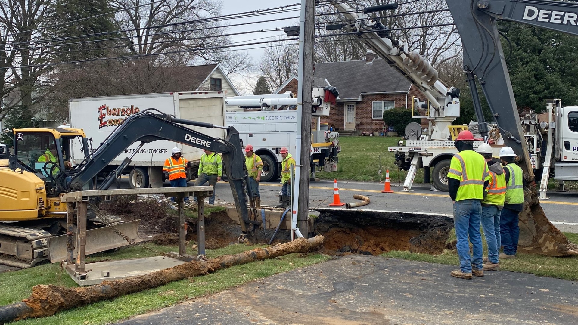 Authorities say the sinkhole impacted gas and power utilities along Fishburn Road, forcing crews to close the street to make repairs.