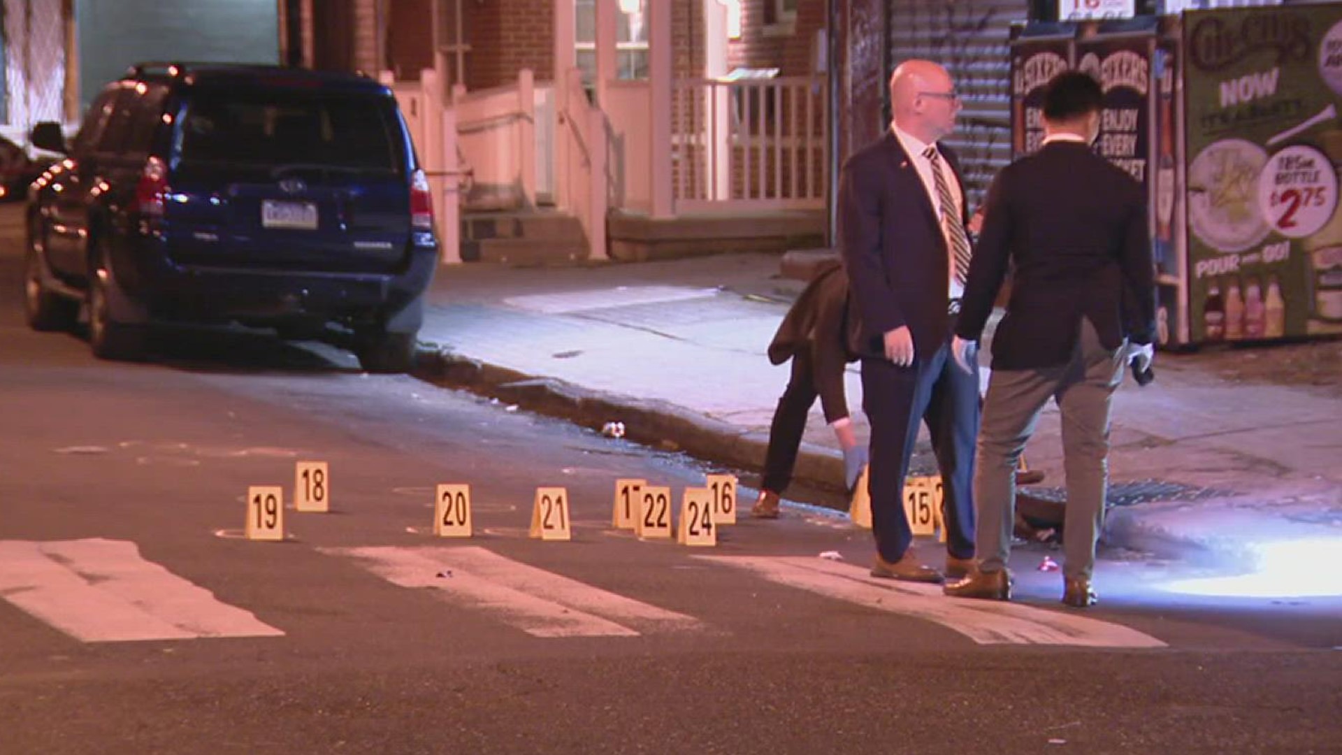 Police say a 2-year-old girl was among seven people wounded in a shooting outside a school in Philadelphia.