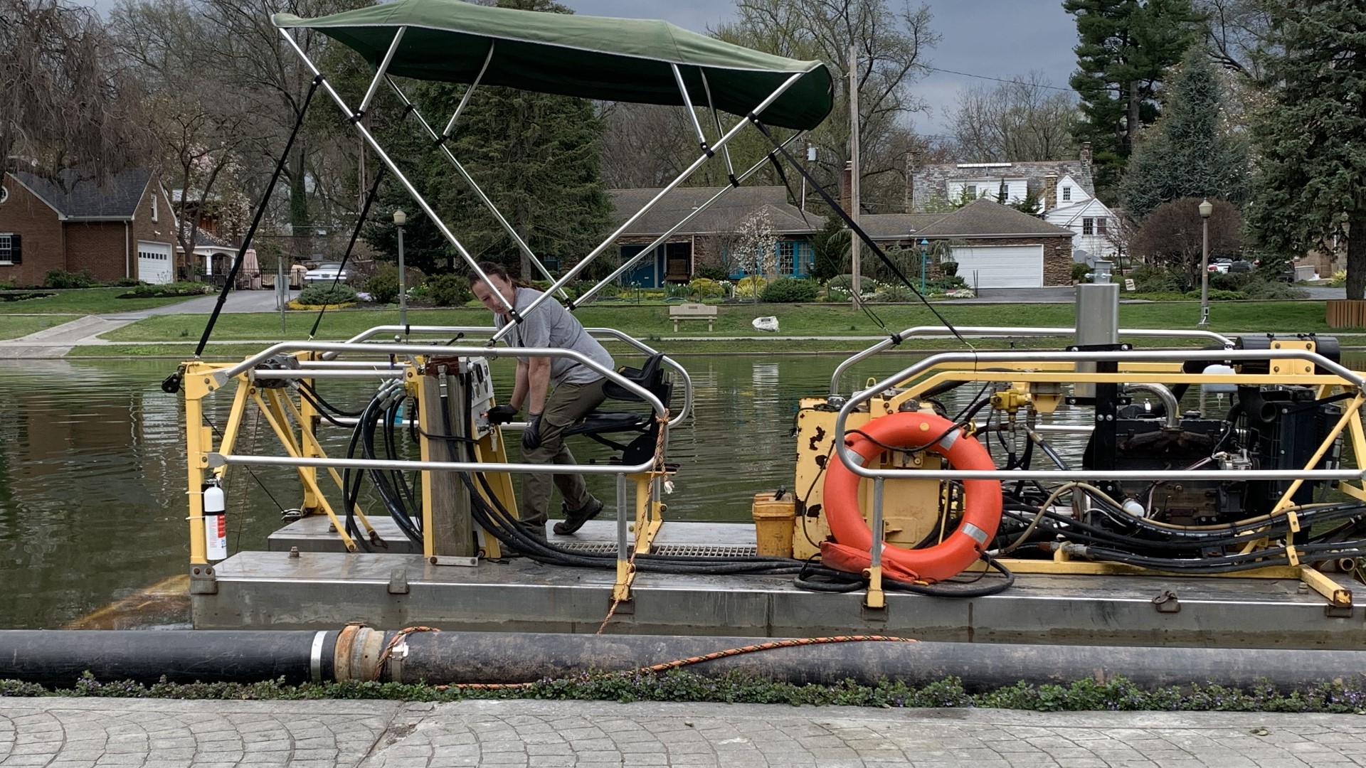 Crews are running a barge through the water to clean trash, debris and sediment from the bottom of the lake.