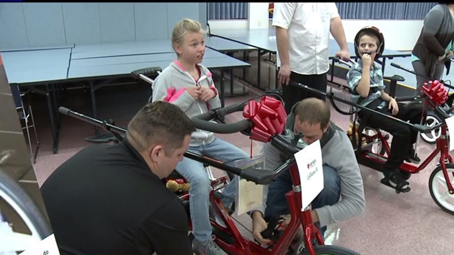 Kids receive custom-made bikes from charity, ride for the first time