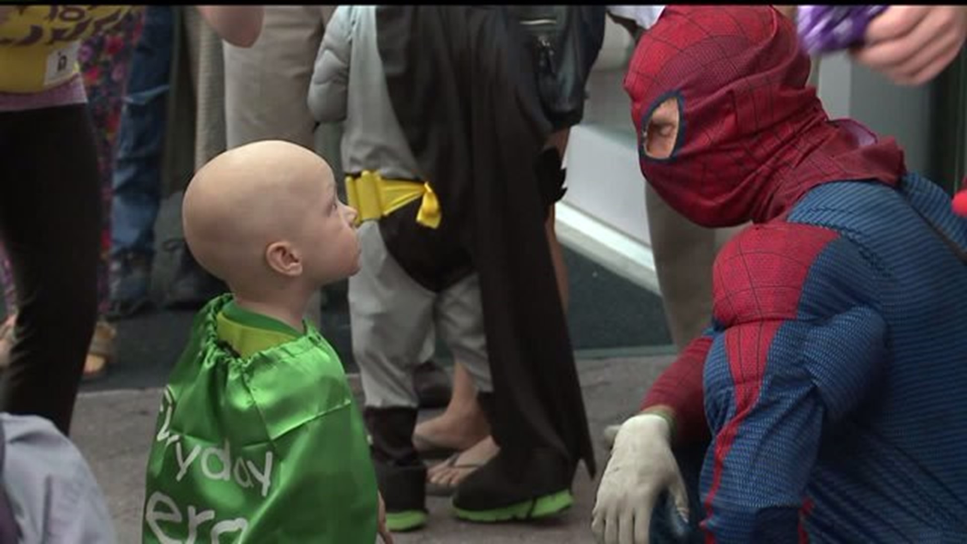 Window-washing superheroes fight grime and brighten day for children at Penn State Hershey