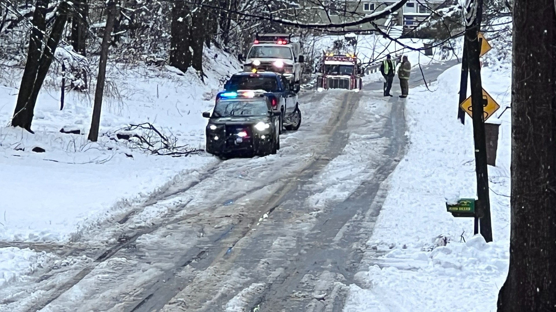 Police say the man died when he collided with a downed utility line while operating a snowmobile.