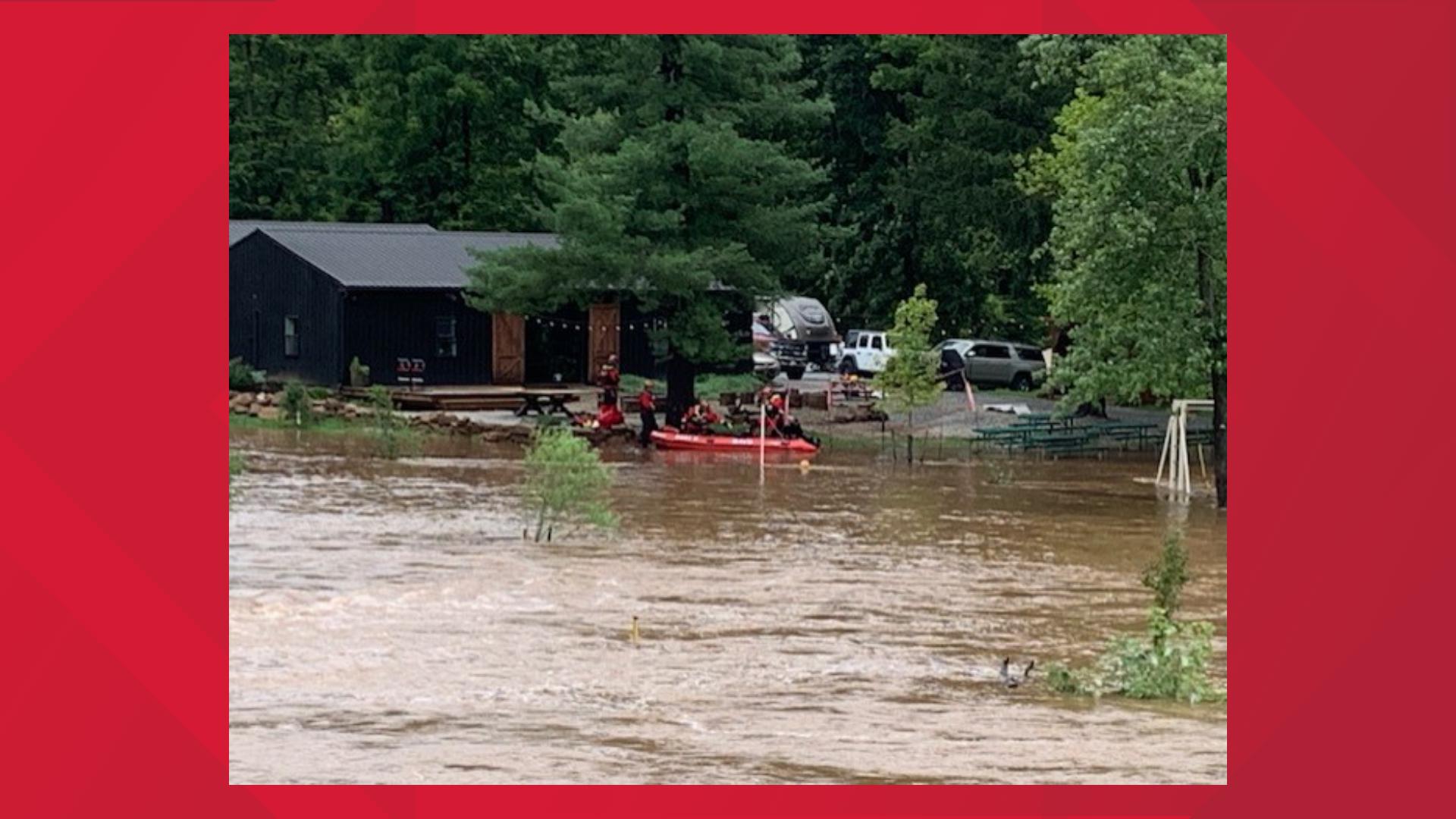 Crews assisted people off Campground Island on Friday, as rains from Debby impacted the area.