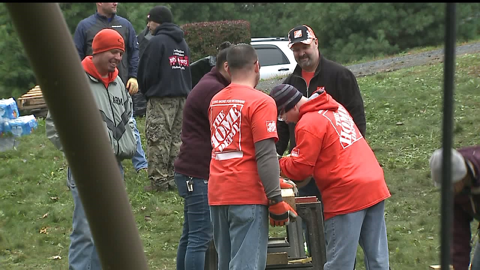 Volunteers from The Home Depot help veteran with home project