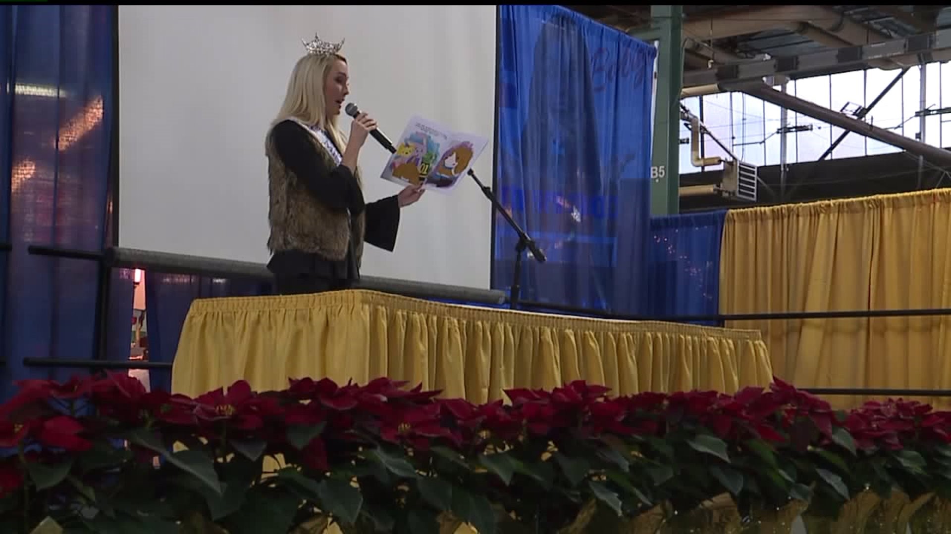 Miss PA reads to children at the farm show