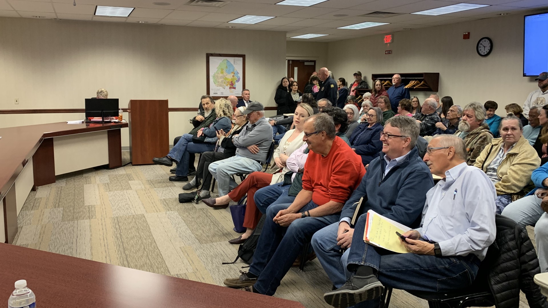 Dozens of people packed a township meeting to oppose the industrial development of land next to the historic Prospect Hill Cemetery.