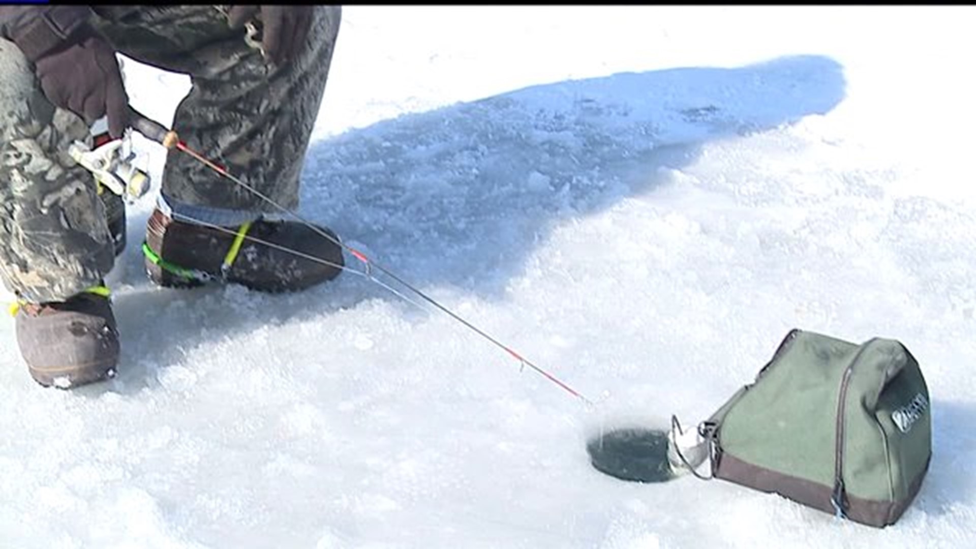 Dedicated ice fisherman stays out from sunrise to sunset on Lake Redman