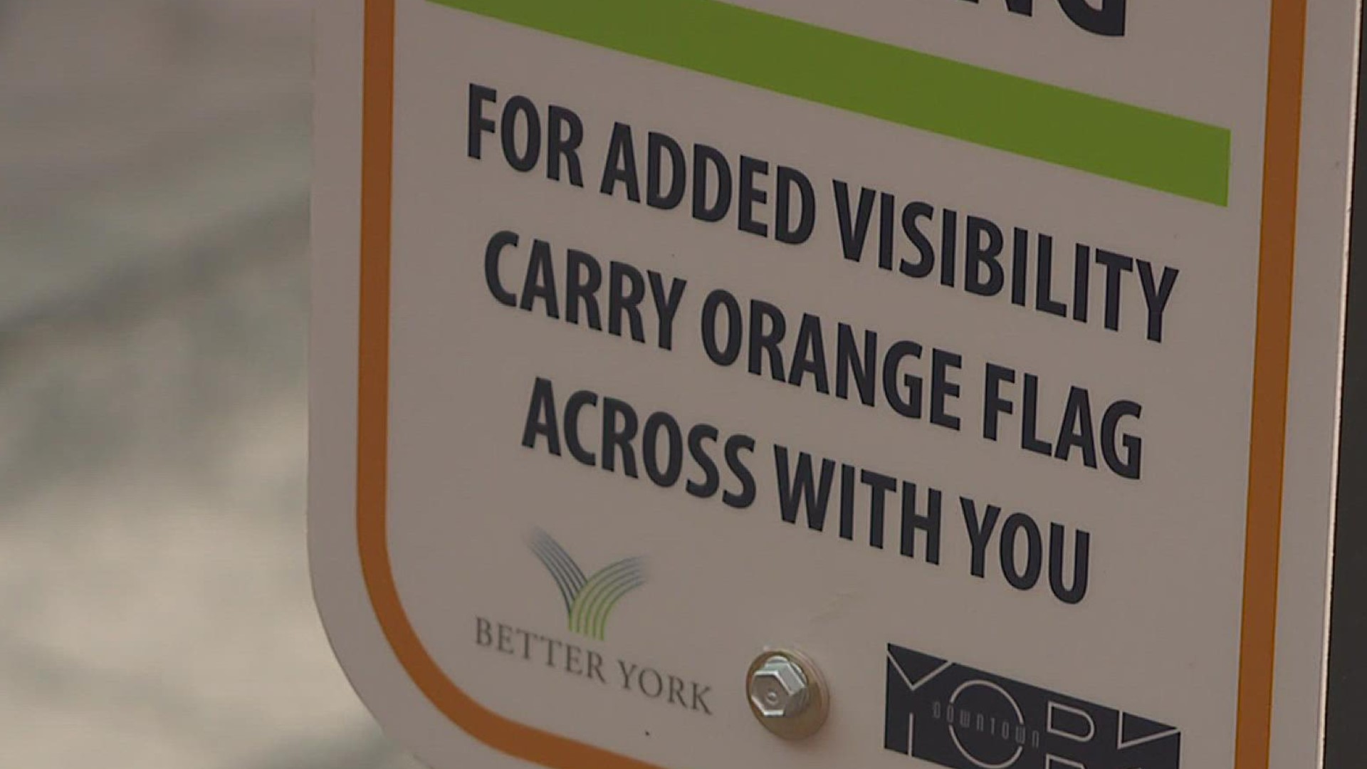 Pedestrians are encouraged to use the flags while walking across streets as a way to increase visibility for drivers.